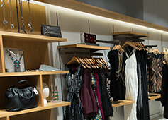 Mendocino rack of clothing lit up with LED flex light.